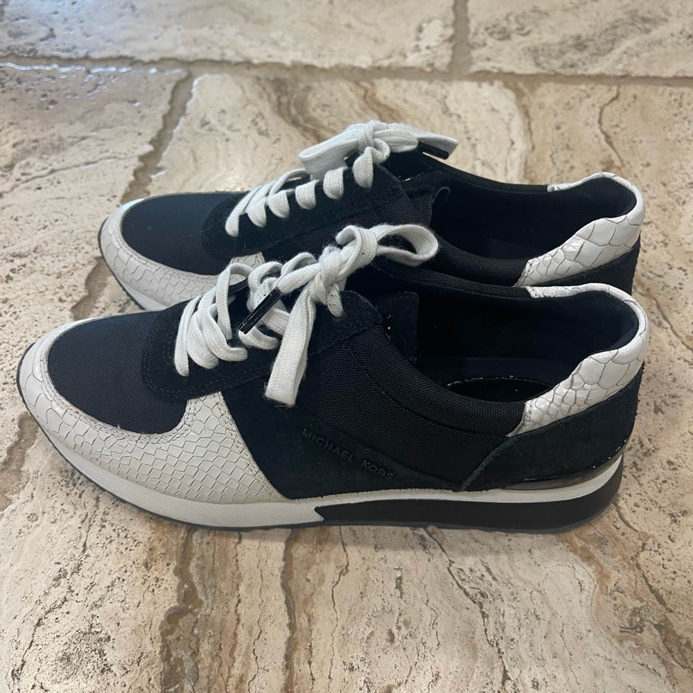 Michael Kors women’s black and white tennis shoe